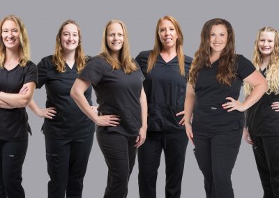 Reading PA dental offices staff photo of a team of female dentists and hygienists wearing all black.