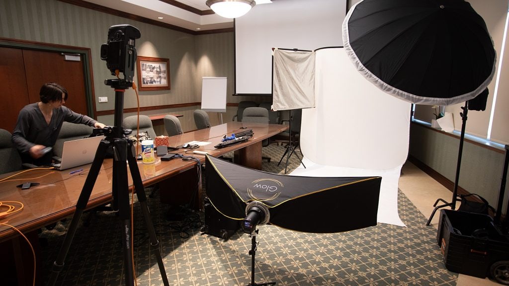 Berks Headshots brings studio lighting and backdrops to a conference room for on-location photos for the UECU executive team. 