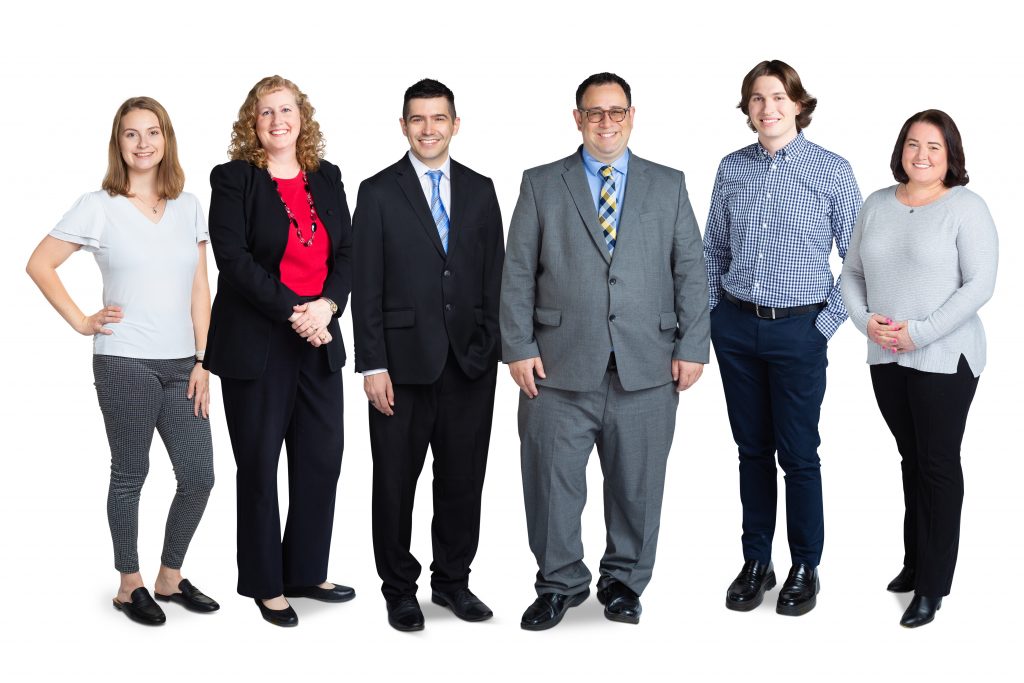 A composite group photo of a law firm's staff on a white background. 