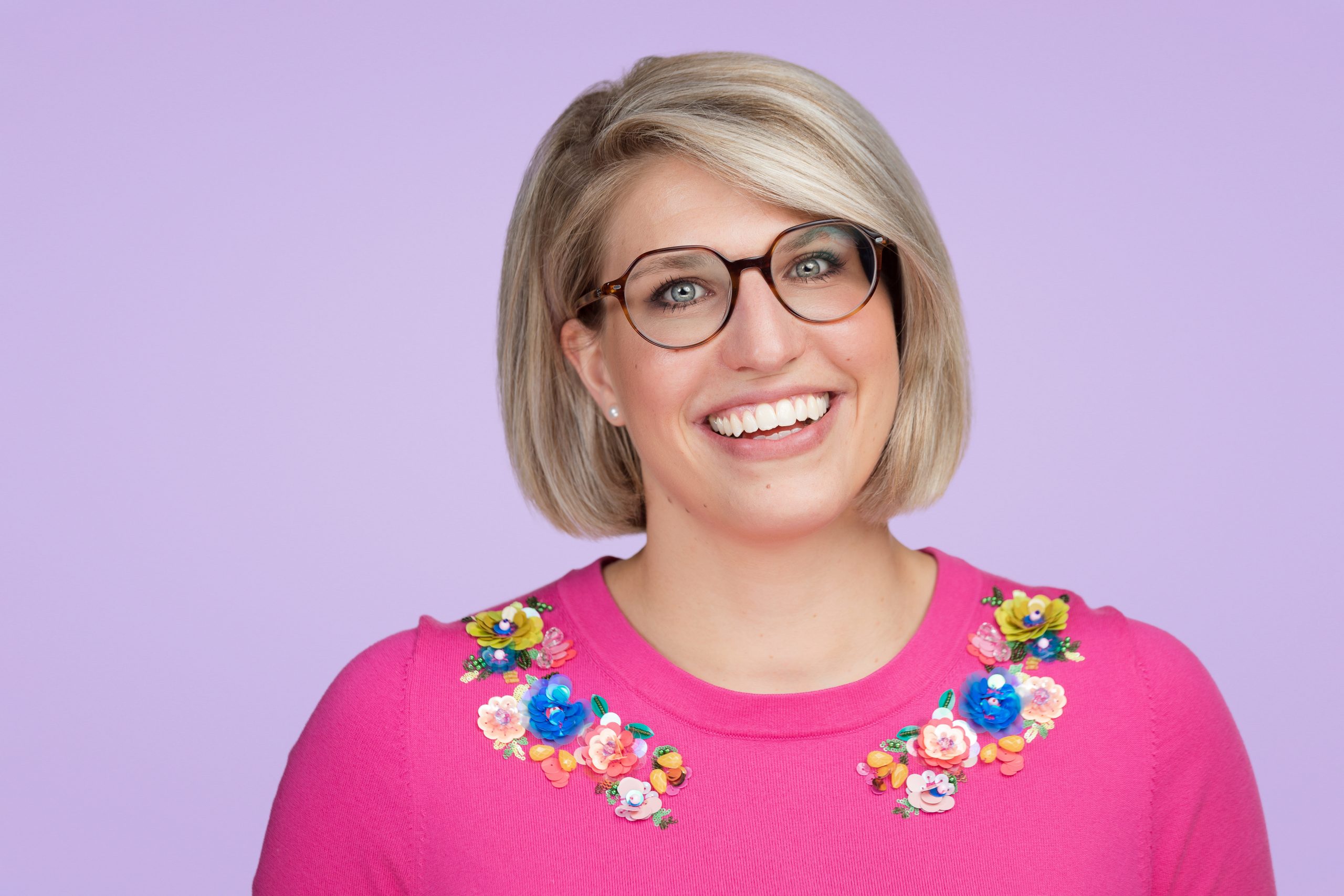 Headshot of a happy business woman, part of a gallery of brand-boosting headshot photos.