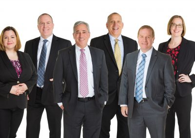 Composite group photo of a professional business team in Berks County wearing suits and ties.