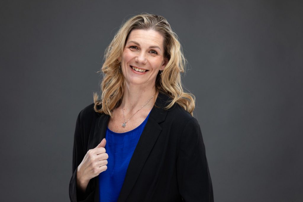 Business woman headshot photo with modern studio background