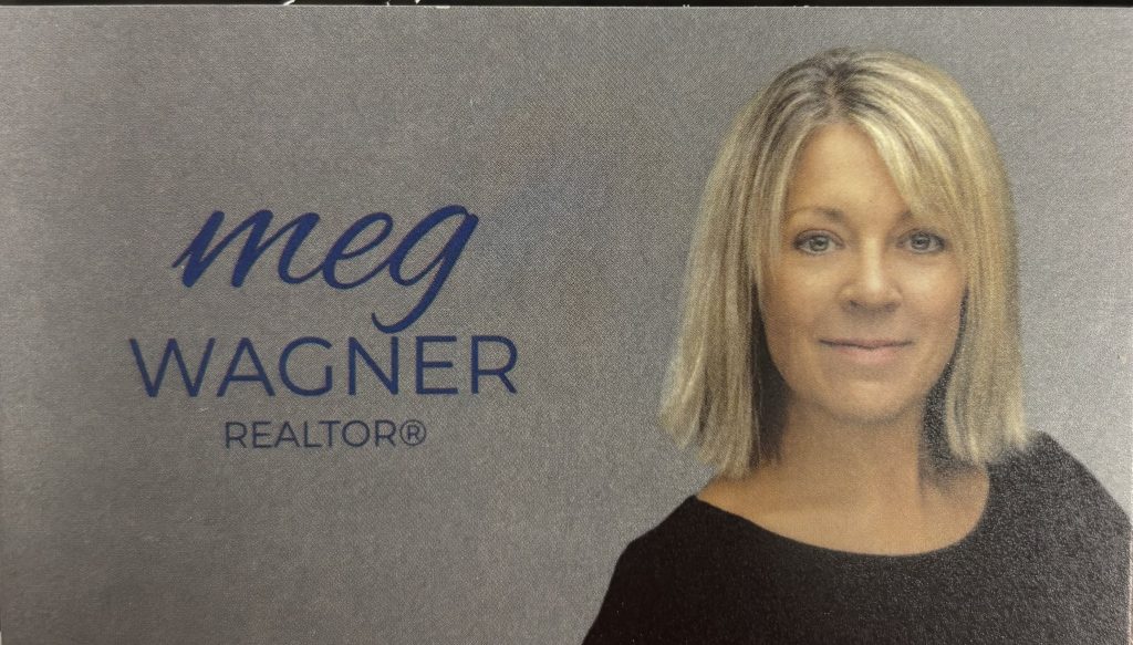 Meg uses the whole front of her business card to show her name, title, and headshot.