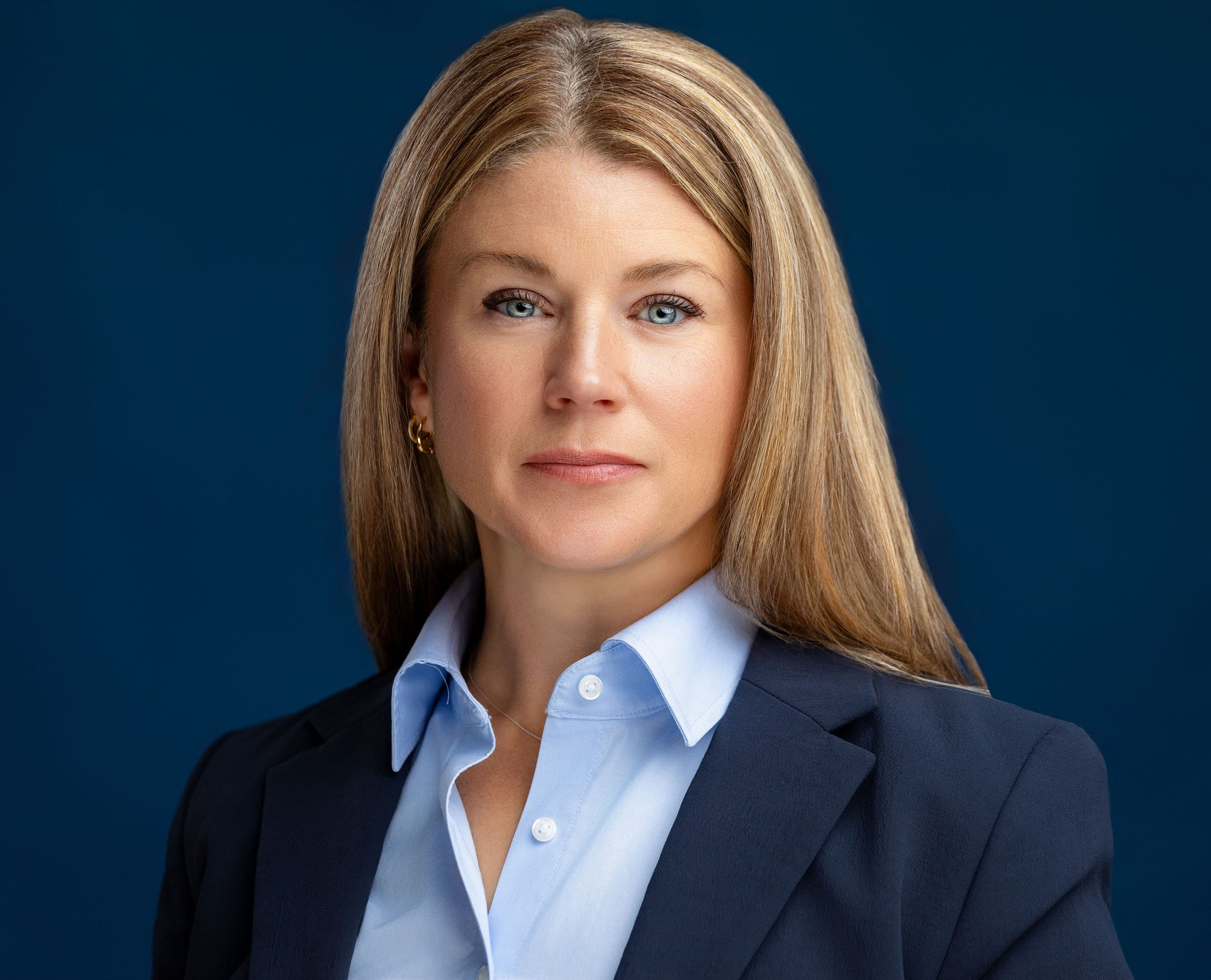 Headshot of a financial advisor looking directly into the camera with a confident, serious expression.